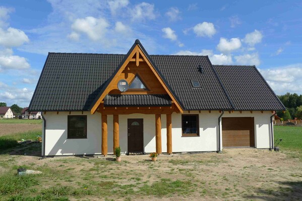 Elbląg DOM DREWNIANY JEDNORODZINNY ECOHOUSE II- Z GARAŻEMJesteśmy firmą zajmującą się produkcją domów drewnianych